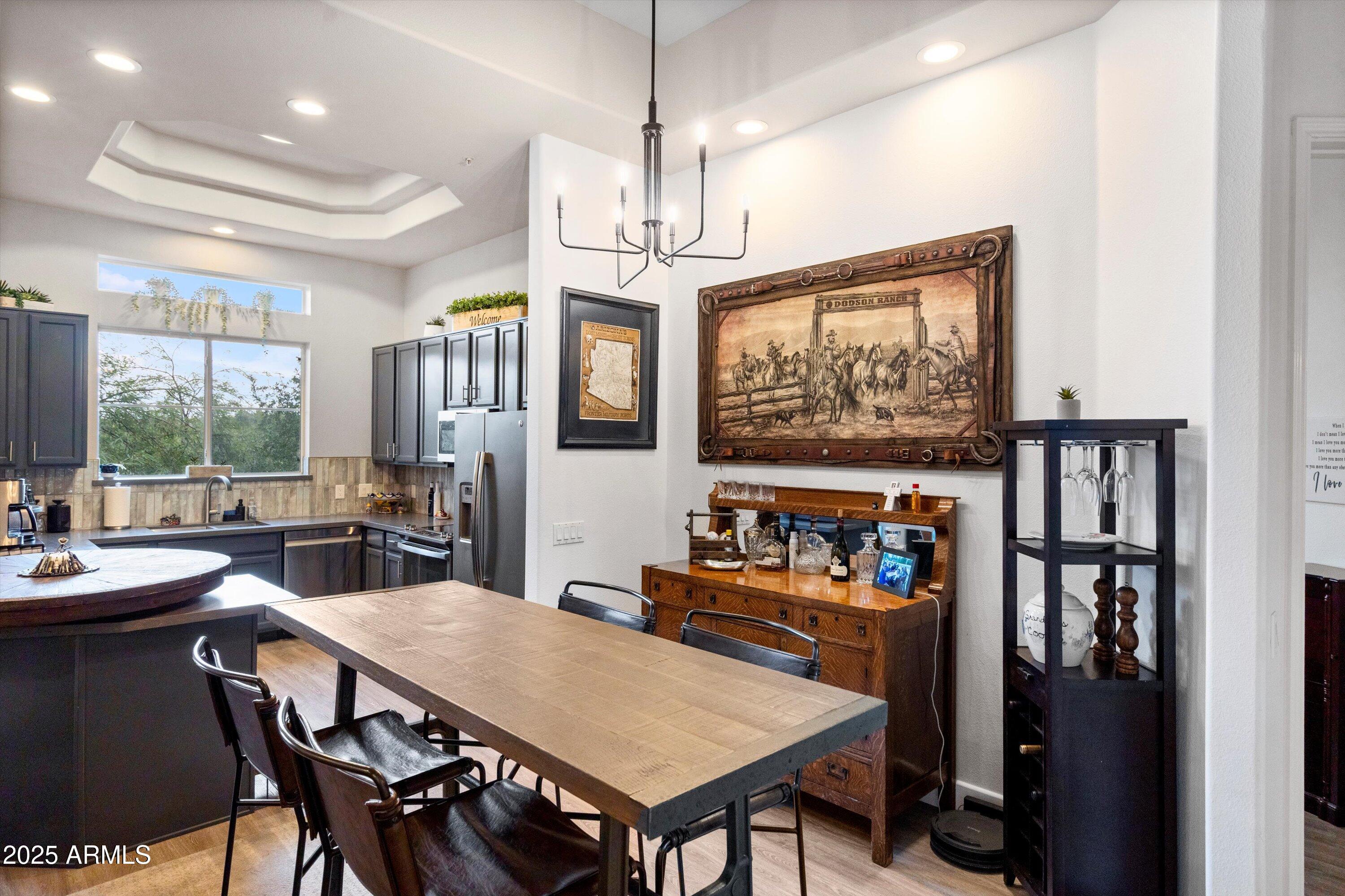 8245 East Bell Road, Unit 250 Scottsdale, AZ 85260 - Photo 16 of 48 a view of a dining room with furniture window and outside view