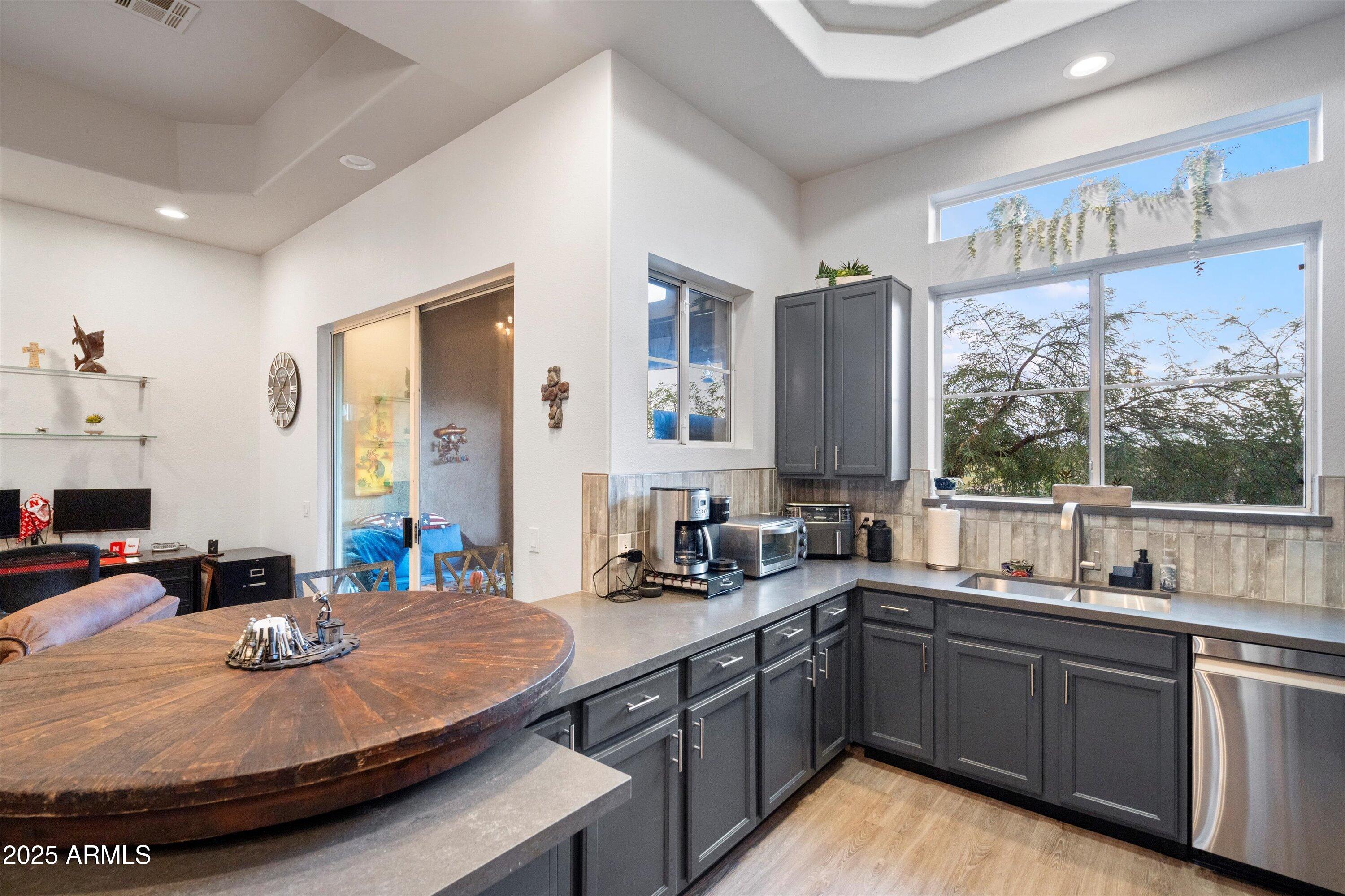 8245 East Bell Road, Unit 250 Scottsdale, AZ 85260 - Photo 19 of 48 a kitchen with sink and window