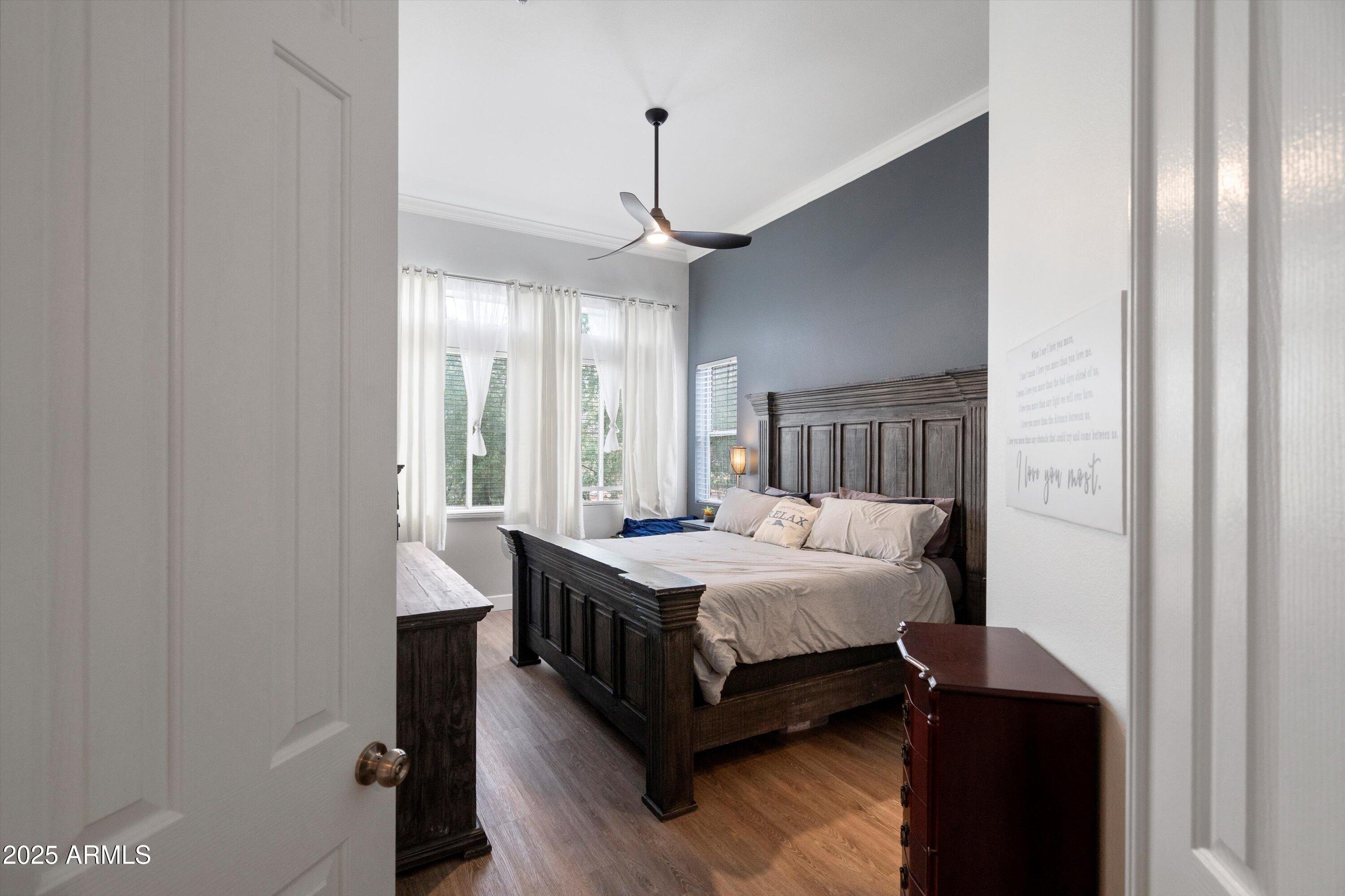 8245 East Bell Road, Unit 250 Scottsdale, AZ 85260 - Photo 24 of 48 a bedroom with a bed and a window