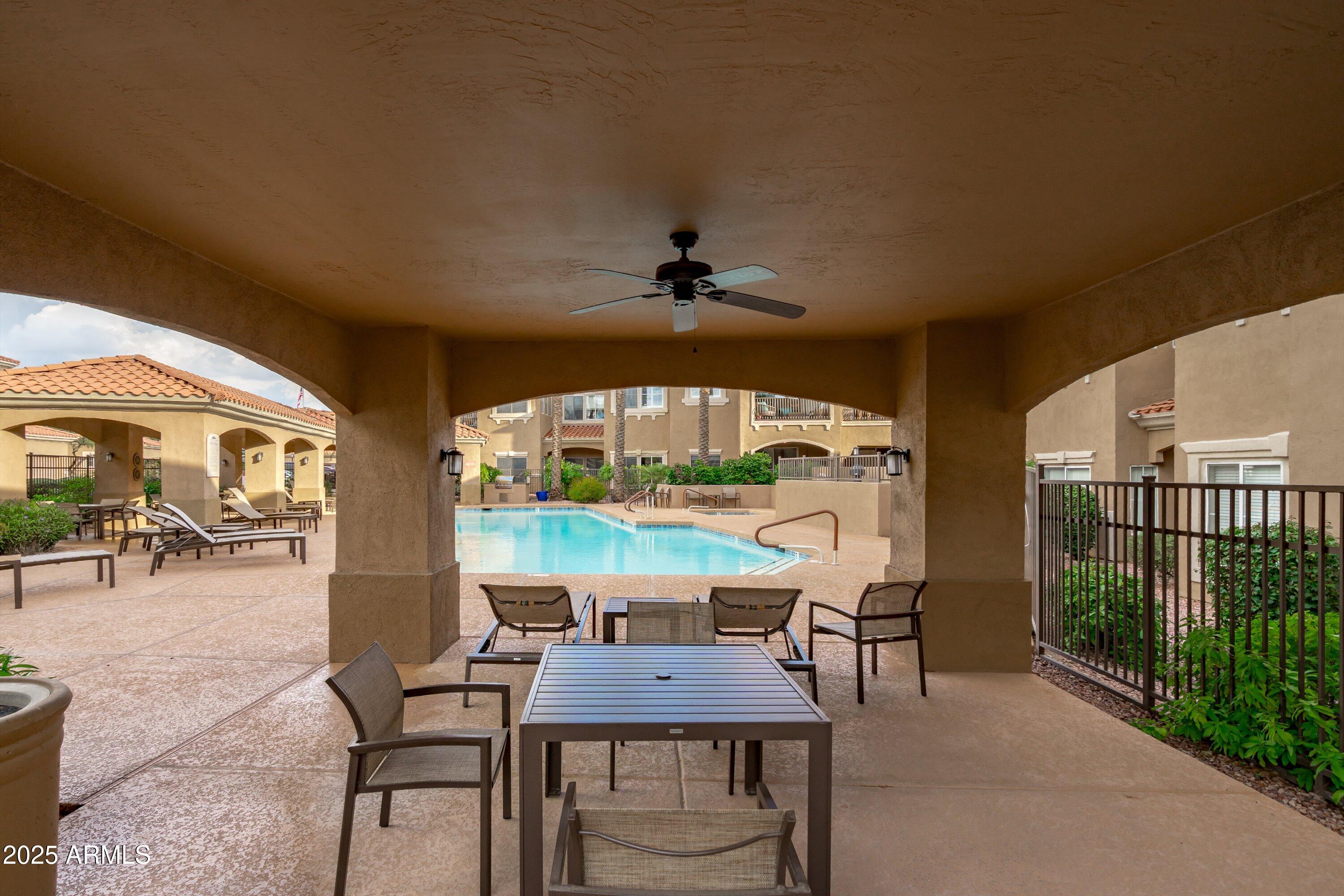 8245 East Bell Road, Unit 250 Scottsdale, AZ 85260 - Photo 41 of 48 a view of a dining room with furniture window and outside view