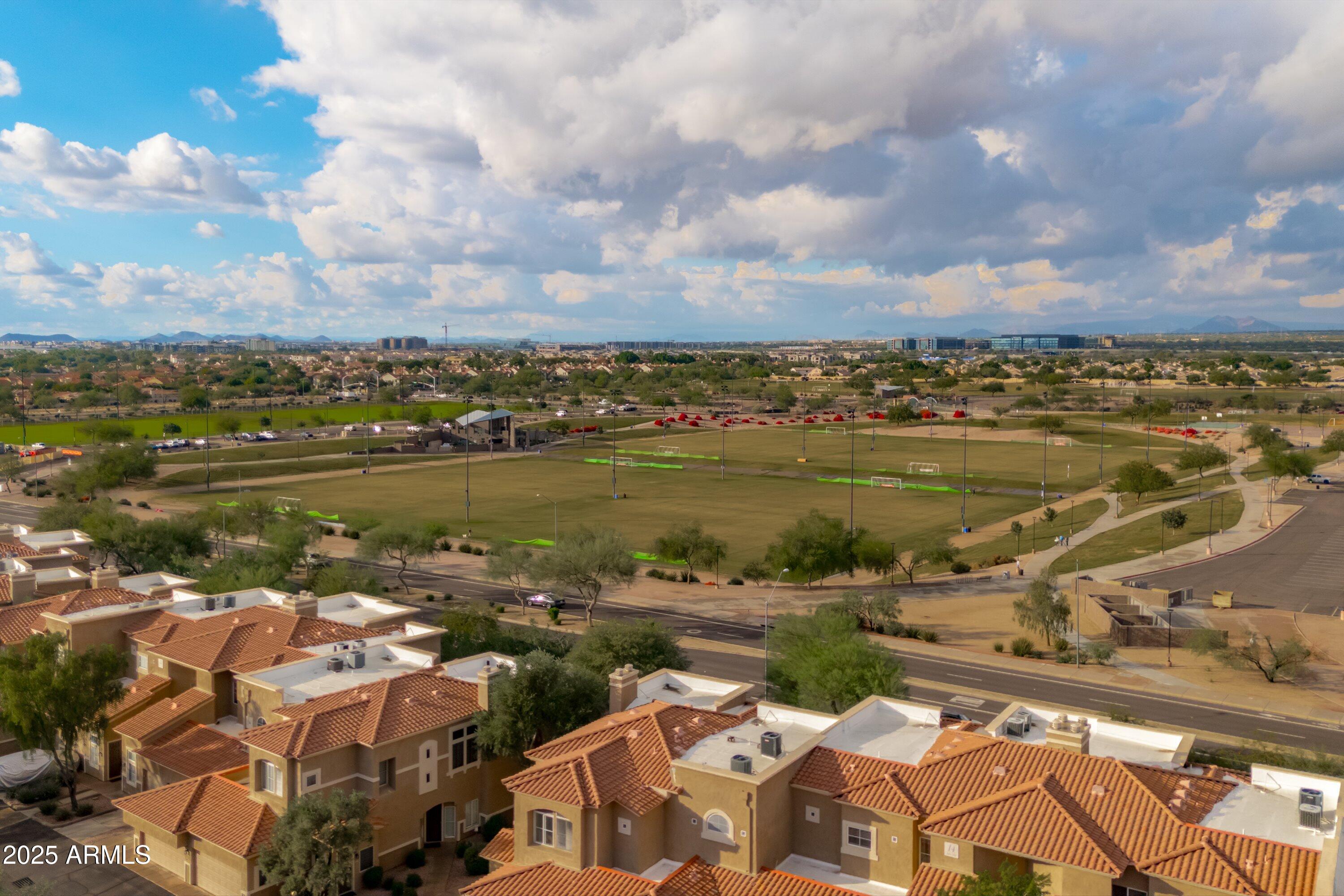 8245 East Bell Road, Unit 250 Scottsdale, AZ 85260 - Photo 44 of 48 an aerial view of ocean and residential houses with outdoor space