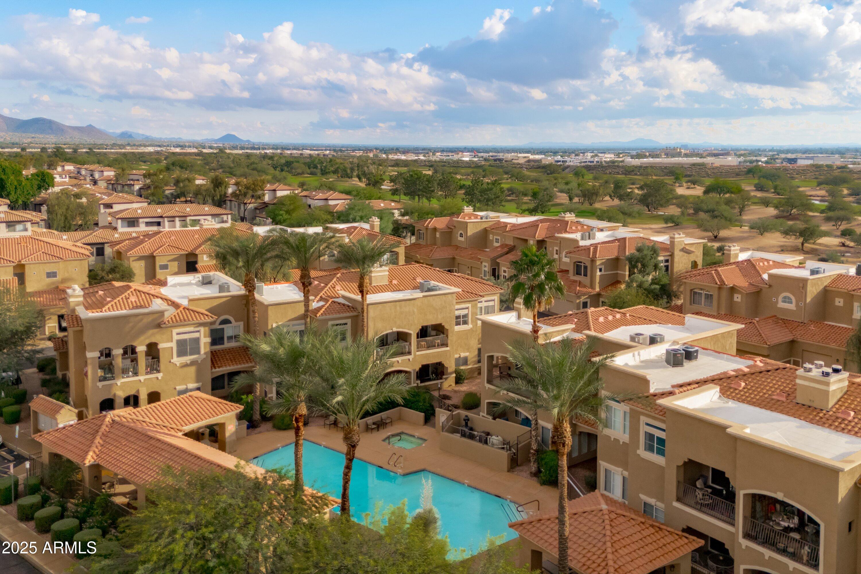 8245 East Bell Road, Unit 250 Scottsdale, AZ 85260 - Photo 3 of 48 an aerial view of residential houses with outdoor space