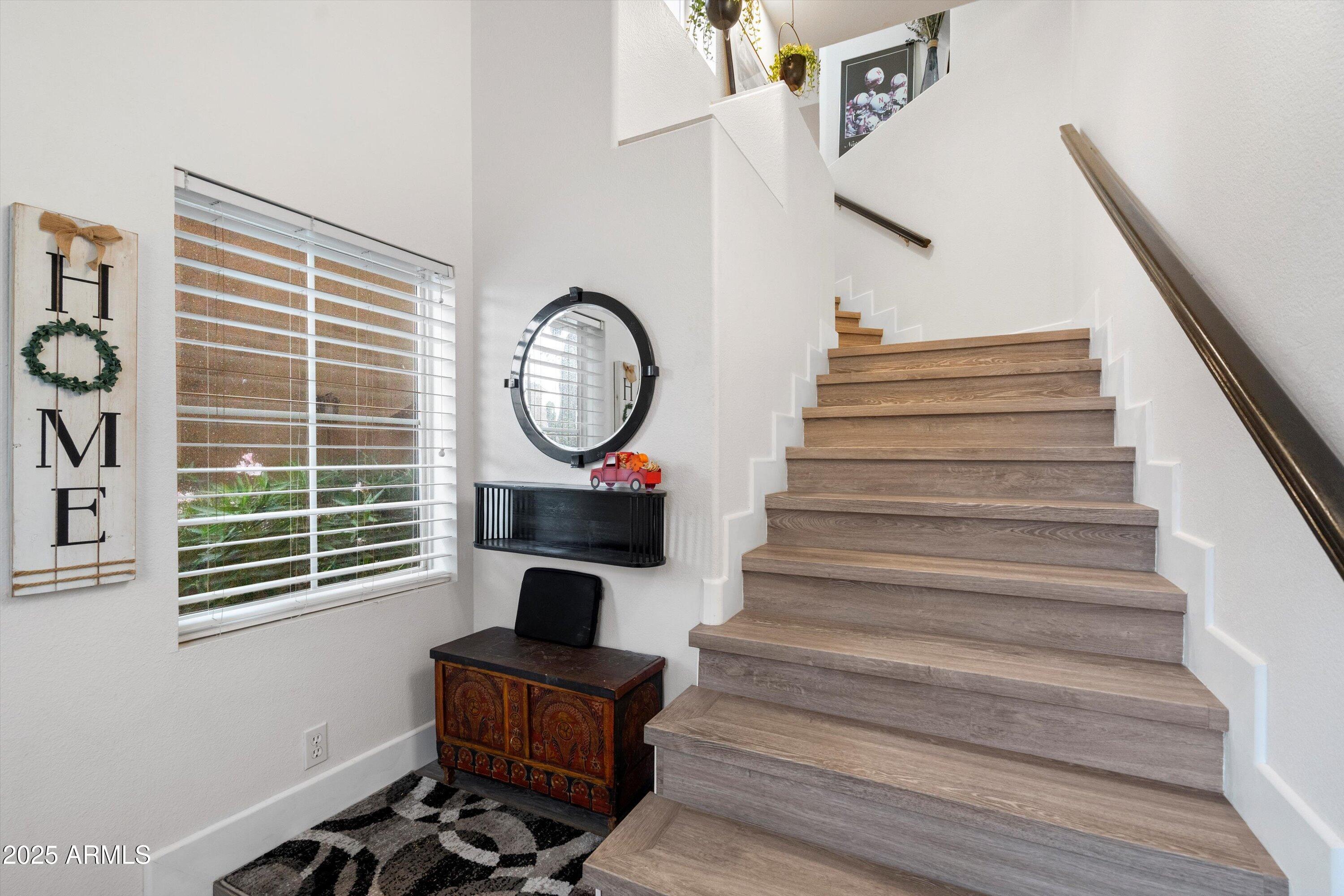 8245 East Bell Road, Unit 250 Scottsdale, AZ 85260 - Photo 5 of 48 a view of entryway and hall with wooden floor
