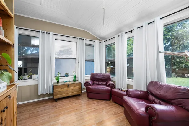 a view of a livingroom with furniture and a window