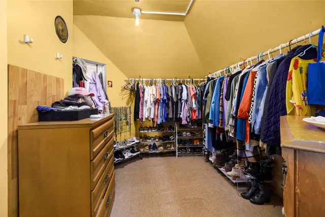 a view of a house with backyard porch and sitting area