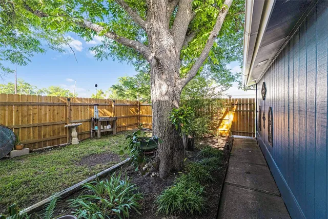 a view of a yard with swimming pool