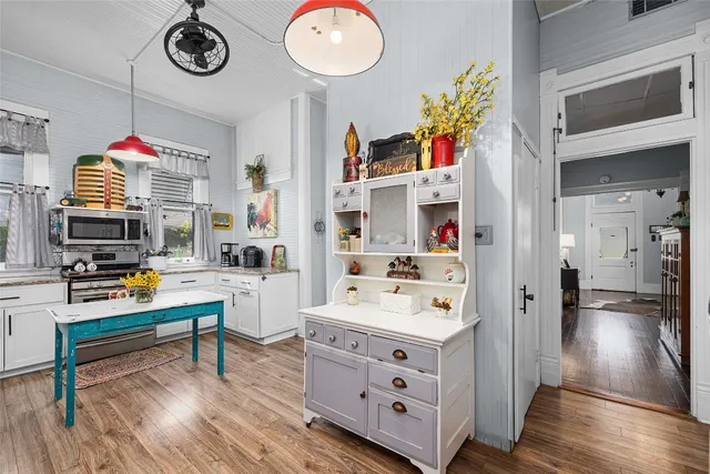 a living room with furniture or window and a lamp