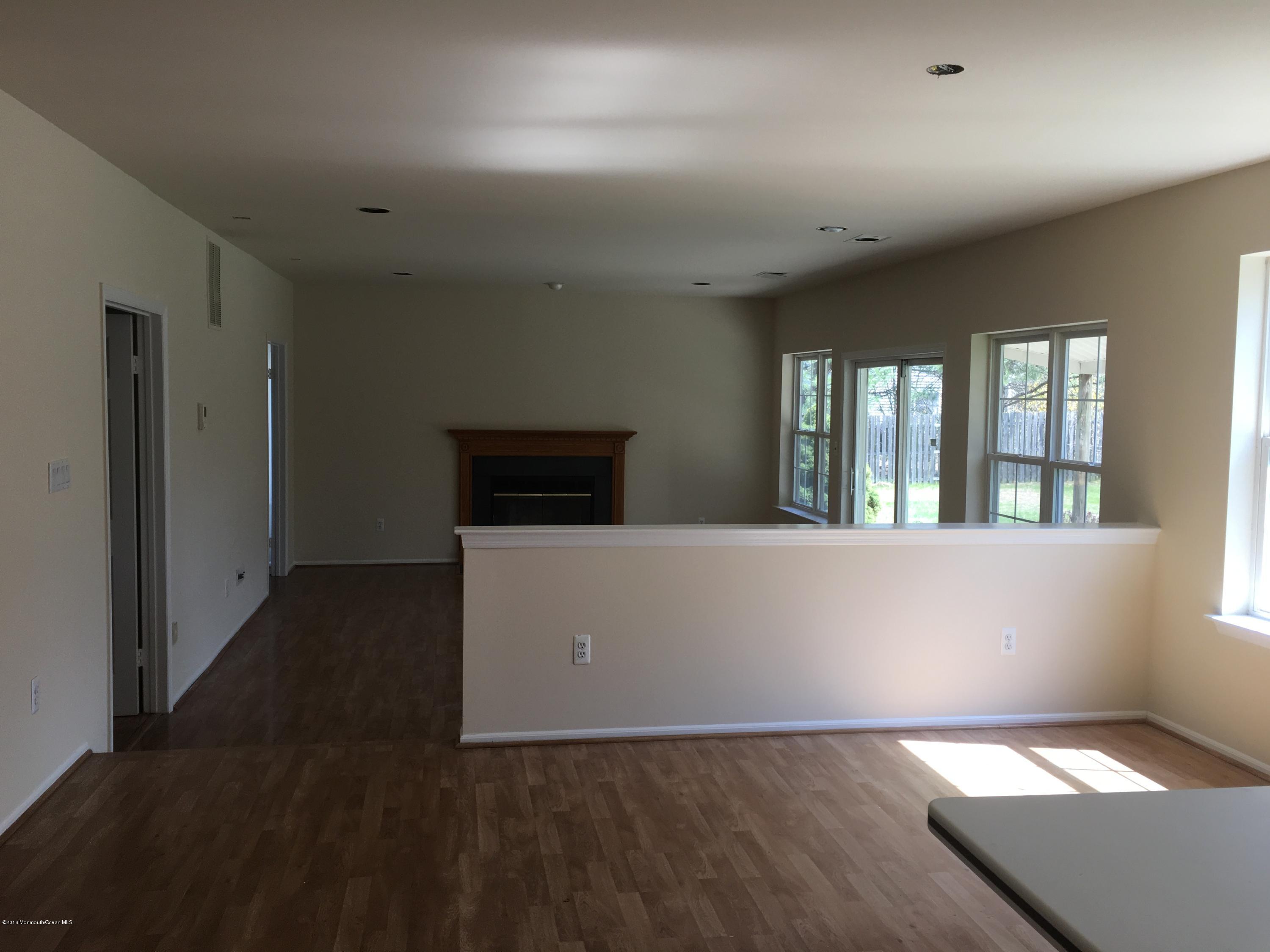 761 Anderson Road Jackson, NJ 08527 - Photo 6 of 22 wooden floor in an empty room with a window