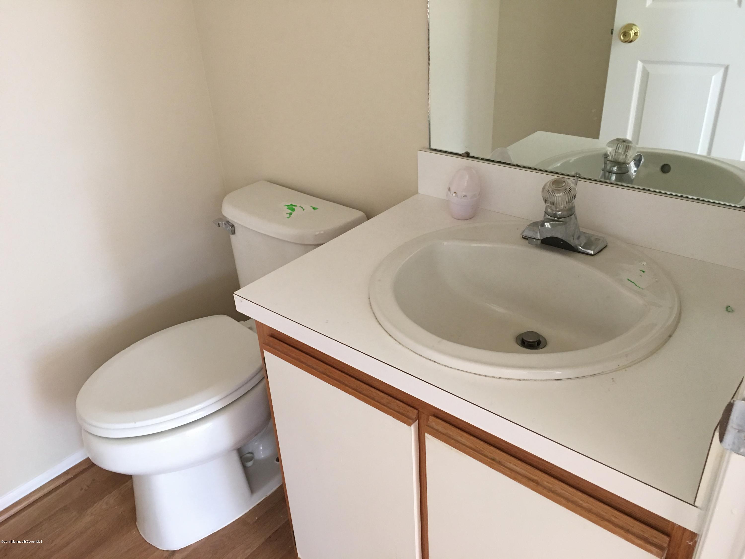 761 Anderson Road Jackson, NJ 08527 - Photo 7 of 22 a bathroom with a sink and a toilet