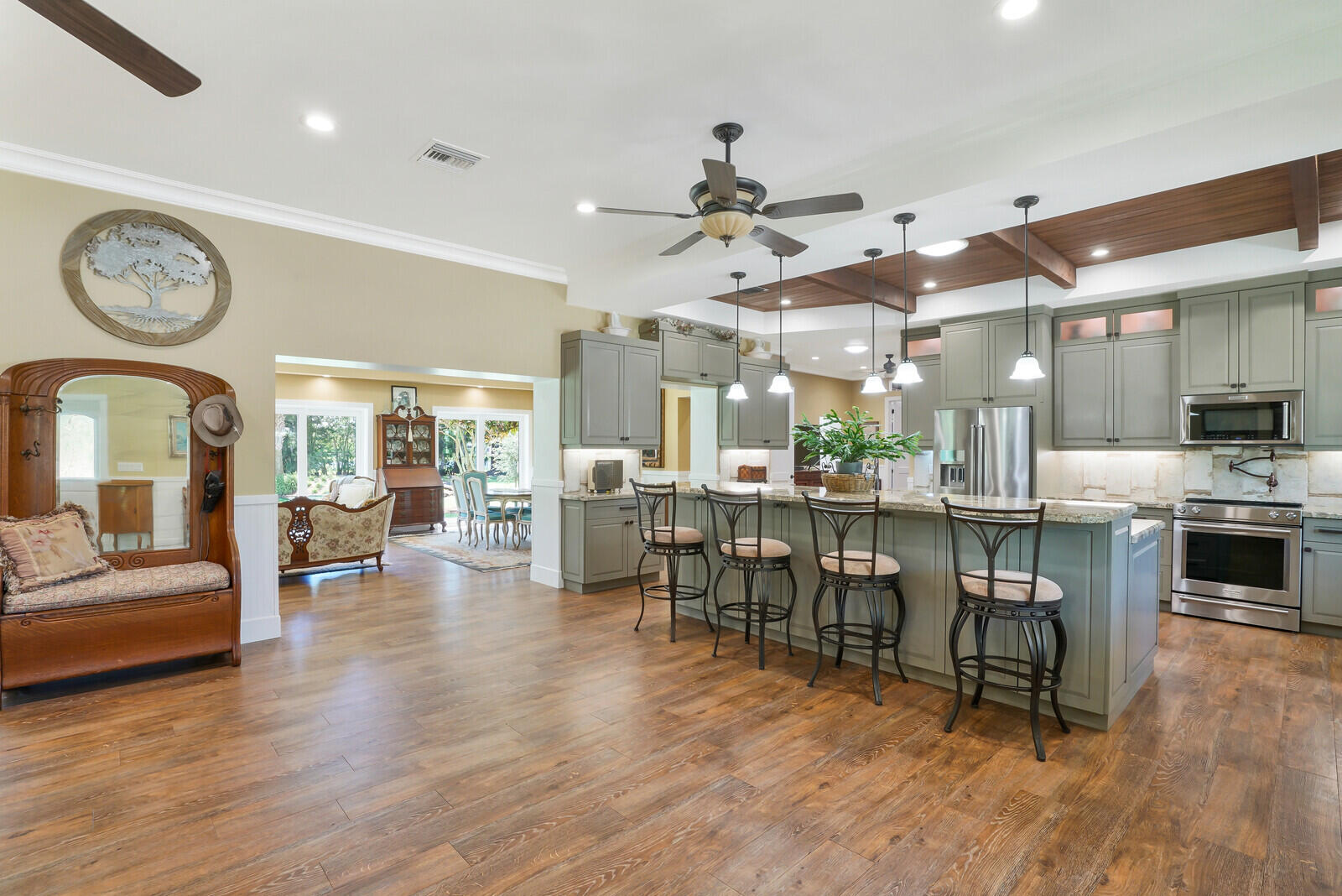 6624 Dillman Road Greenacres, FL 33413 - Photo 11 of 61 a living room with furniture a wooden floor and a clock