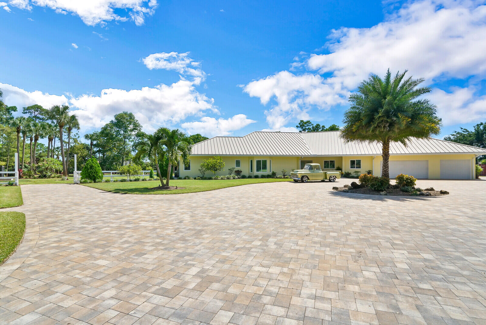 6624 Dillman Road Greenacres, FL 33413 - Photo 13 of 61 a view of a house with a yard and potted plants