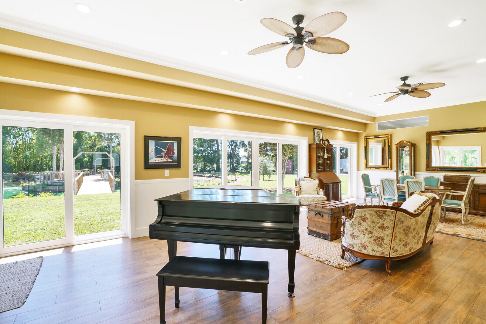 6624 Dillman Road Greenacres, FL 33413 - Photo 22 of 61 a living room with furniture and a floor to ceiling window