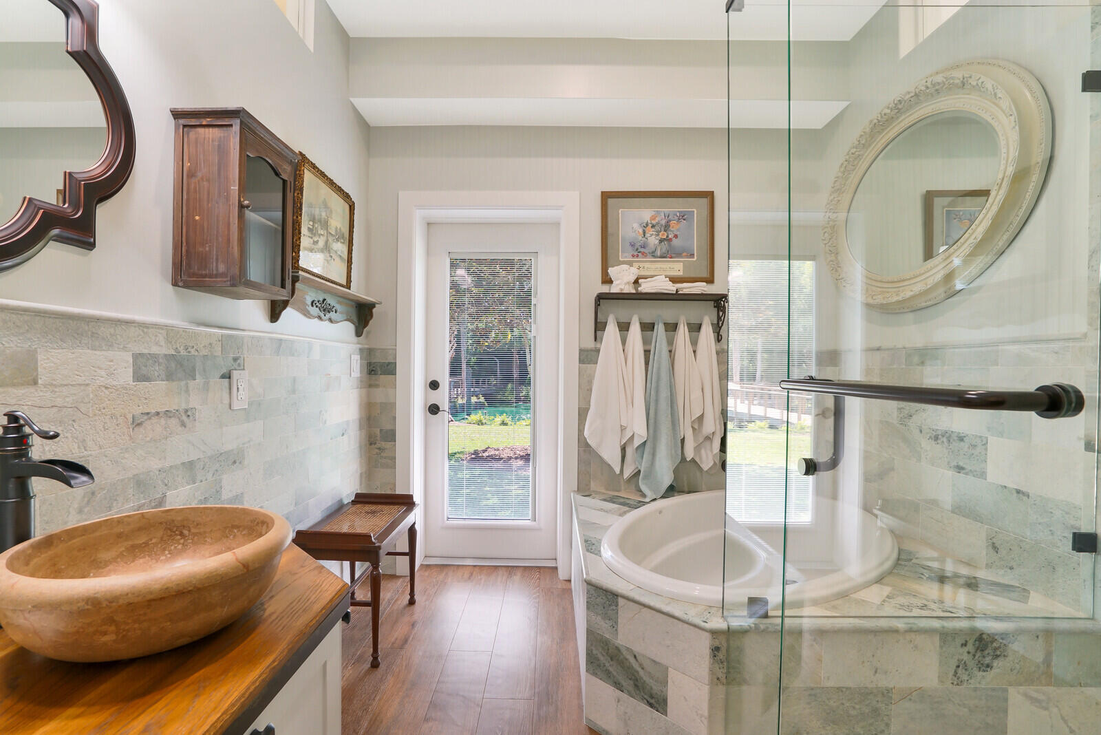 6624 Dillman Road Greenacres, FL 33413 - Photo 30 of 61 a bathroom with a tub a sink and a mirror