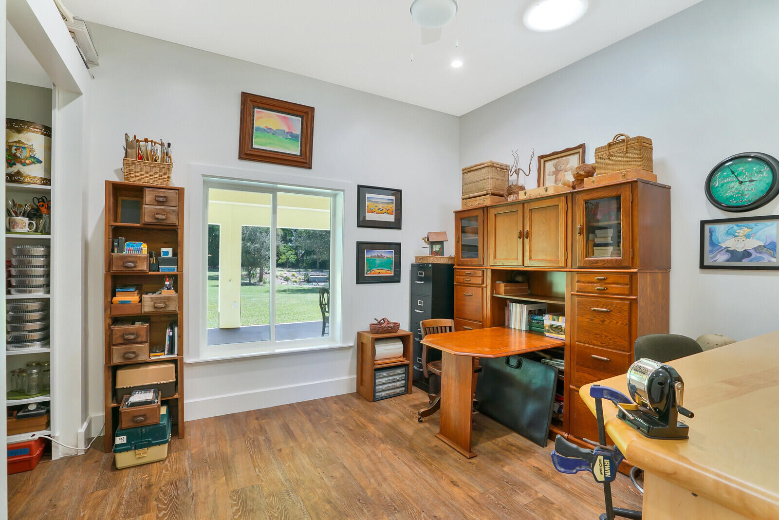 6624 Dillman Road Greenacres, FL 33413 - Photo 37 of 61 a view of a livingroom with furniture and workspace