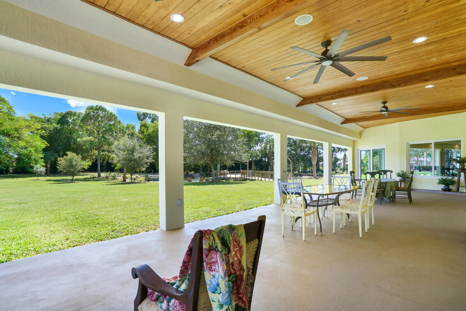6624 Dillman Road Greenacres, FL 33413 - Photo 41 of 61 a view of a patio with a table chairs and backyard