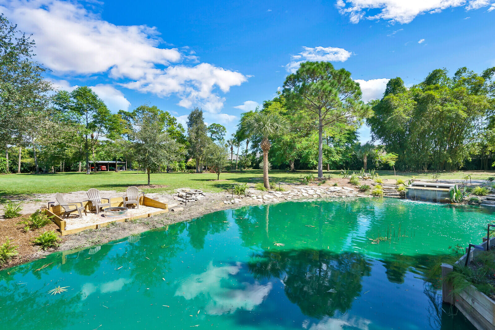 6624 Dillman Road Greenacres, FL 33413 - Photo 42 of 61 a view of a swimming pool with a yard