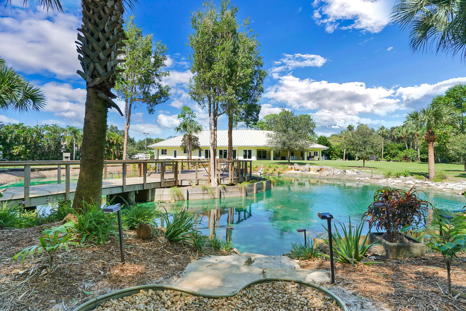 6624 Dillman Road Greenacres, FL 33413 - Photo 44 of 61 a view of a lake with a big yard