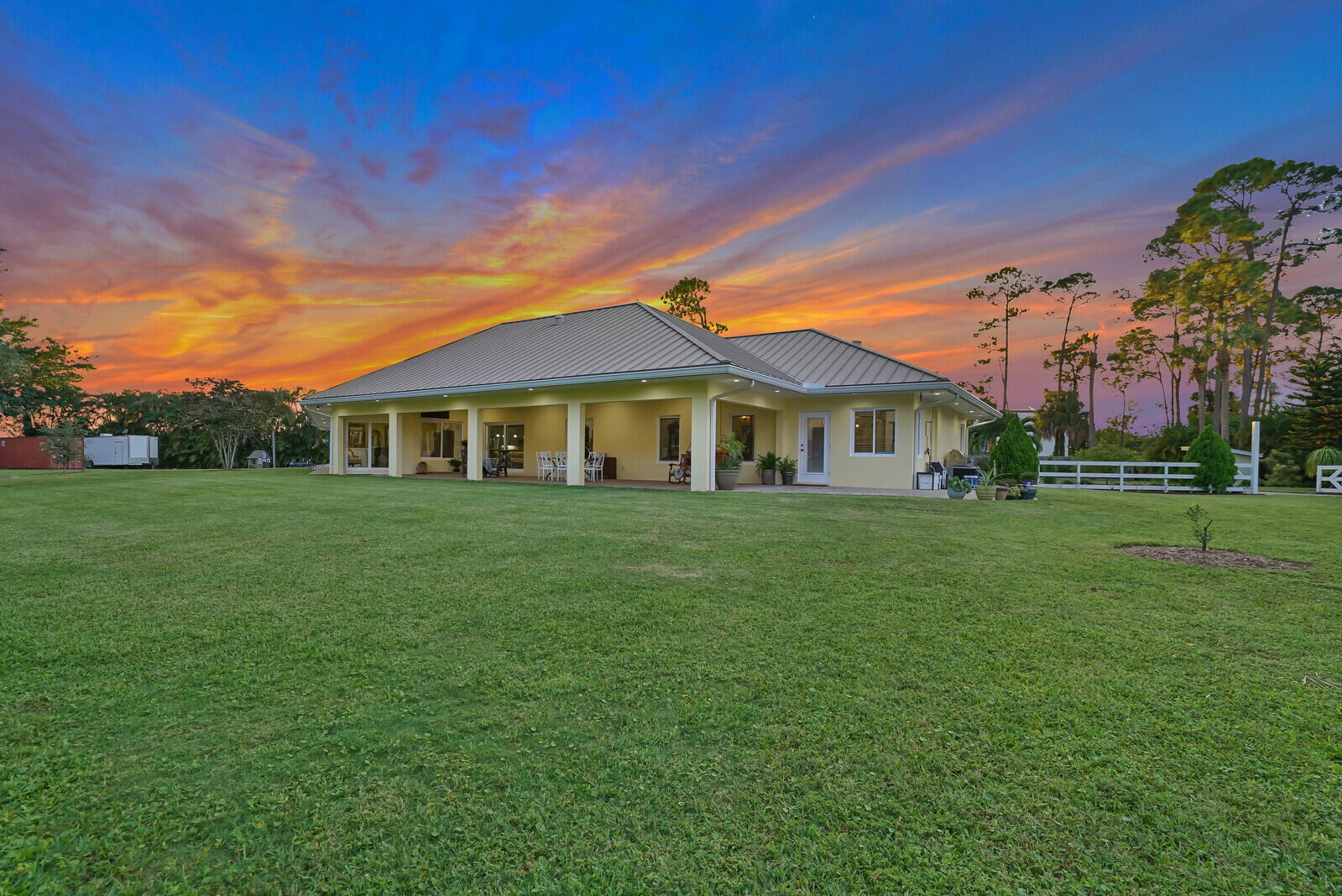 6624 Dillman Road Greenacres, FL 33413 - Photo 54 of 61 a front view of a house with a yard