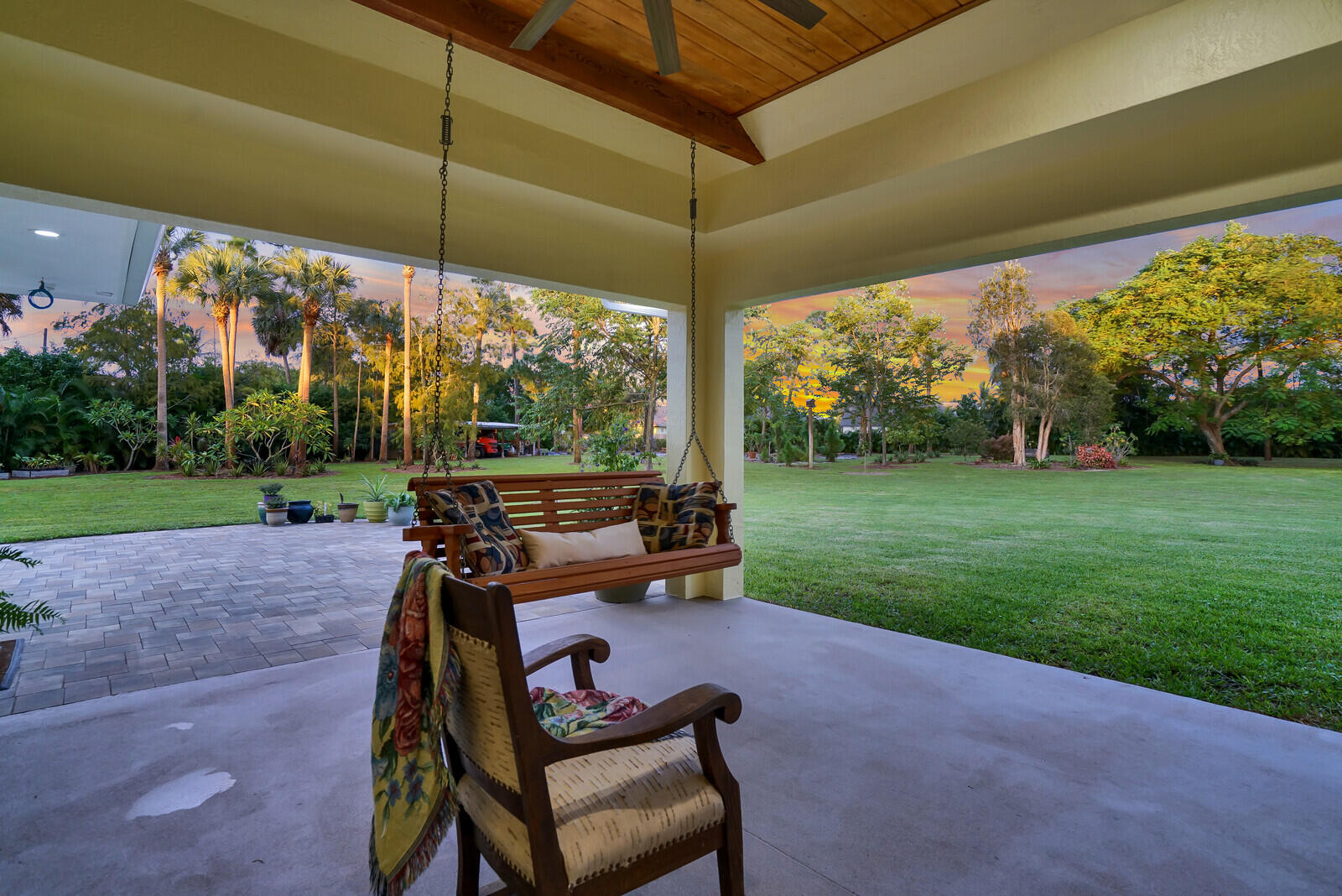 6624 Dillman Road Greenacres, FL 33413 - Photo 55 of 61 a view of a chair and table in the garden