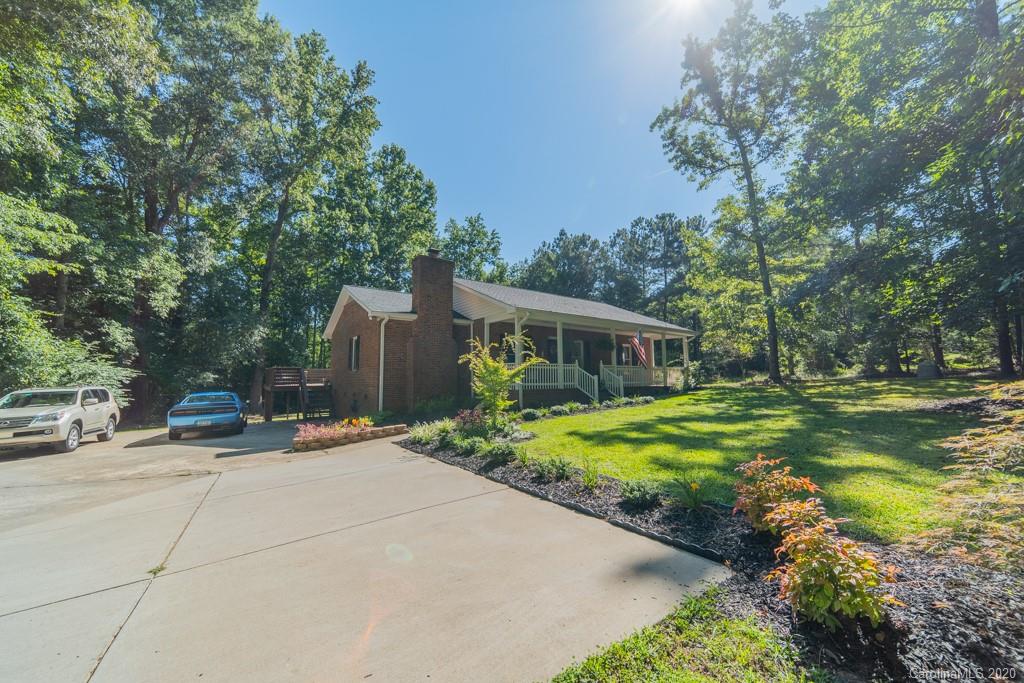 3440 Dobys Bridge Road Fort Mill, SC 29715 - Photo 2 of 25 a backyard of a house with yard and outdoor seating