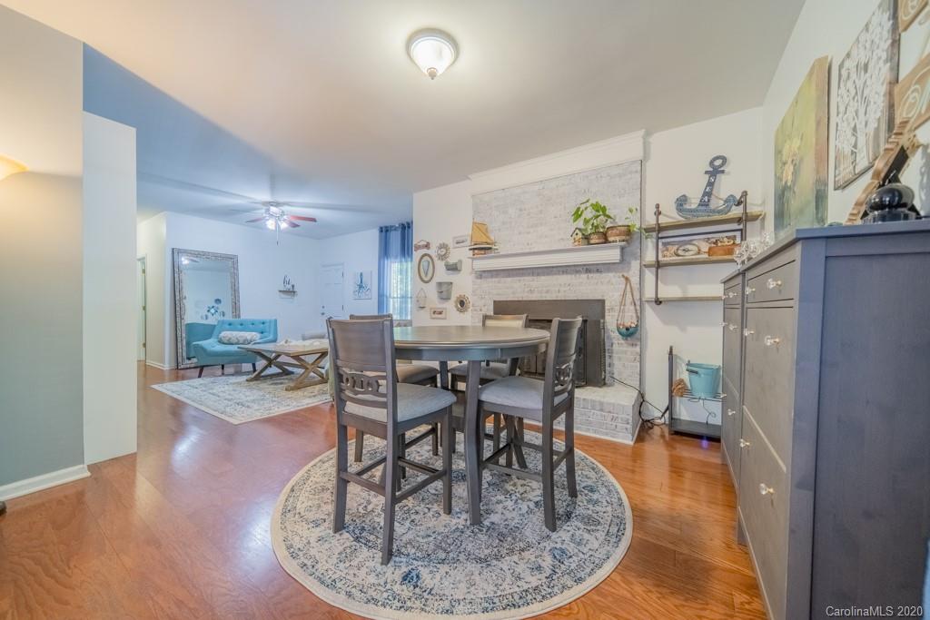 3440 Dobys Bridge Road Fort Mill, SC 29715 - Photo 11 of 25 a dining room with furniture and wooden floor