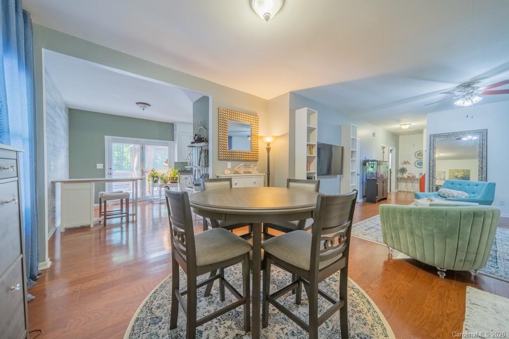 3440 Dobys Bridge Road Fort Mill, SC 29715 - Photo 12 of 25 a dining room with furniture and wooden floor