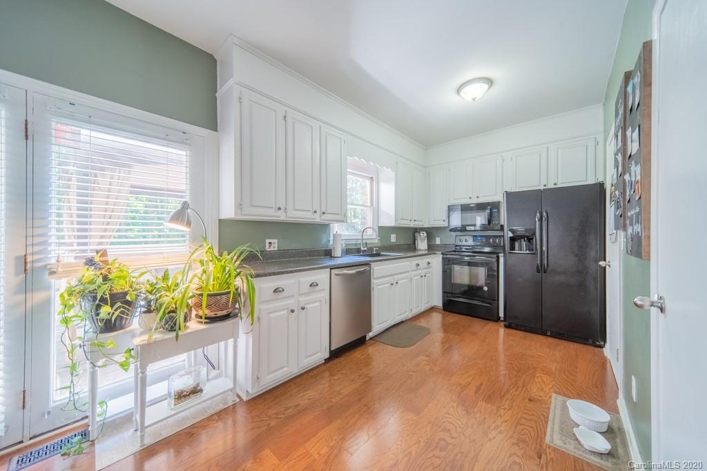 3440 Dobys Bridge Road Fort Mill, SC 29715 - Photo 14 of 25 a kitchen with stainless steel appliances a refrigerator sink and white cabinets