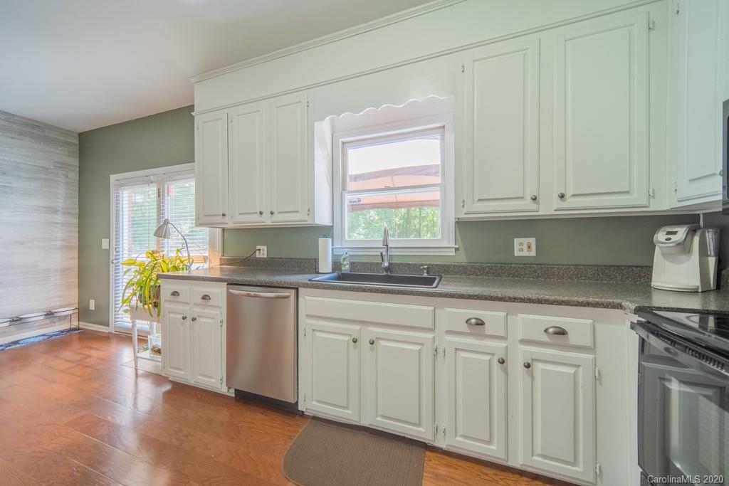 3440 Dobys Bridge Road Fort Mill, SC 29715 - Photo 16 of 25 a kitchen with white cabinets white appliances and sink