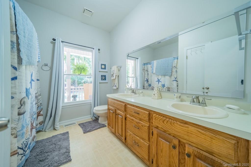 3440 Dobys Bridge Road Fort Mill, SC 29715 - Photo 20 of 25 a spacious bathroom with double vanity and a mirror