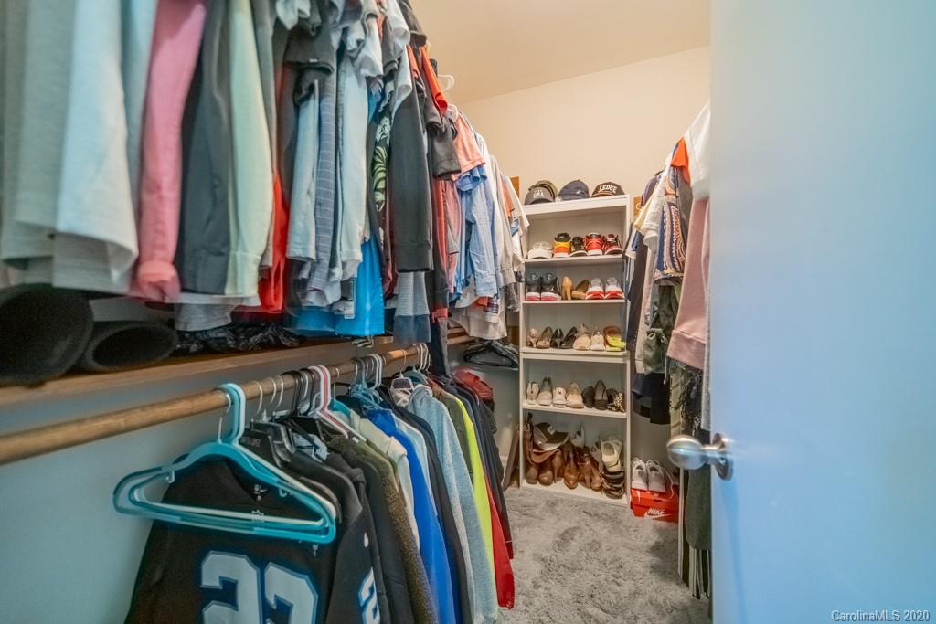 3440 Dobys Bridge Road Fort Mill, SC 29715 - Photo 23 of 25 a view of walk in closet with clothes and shoes