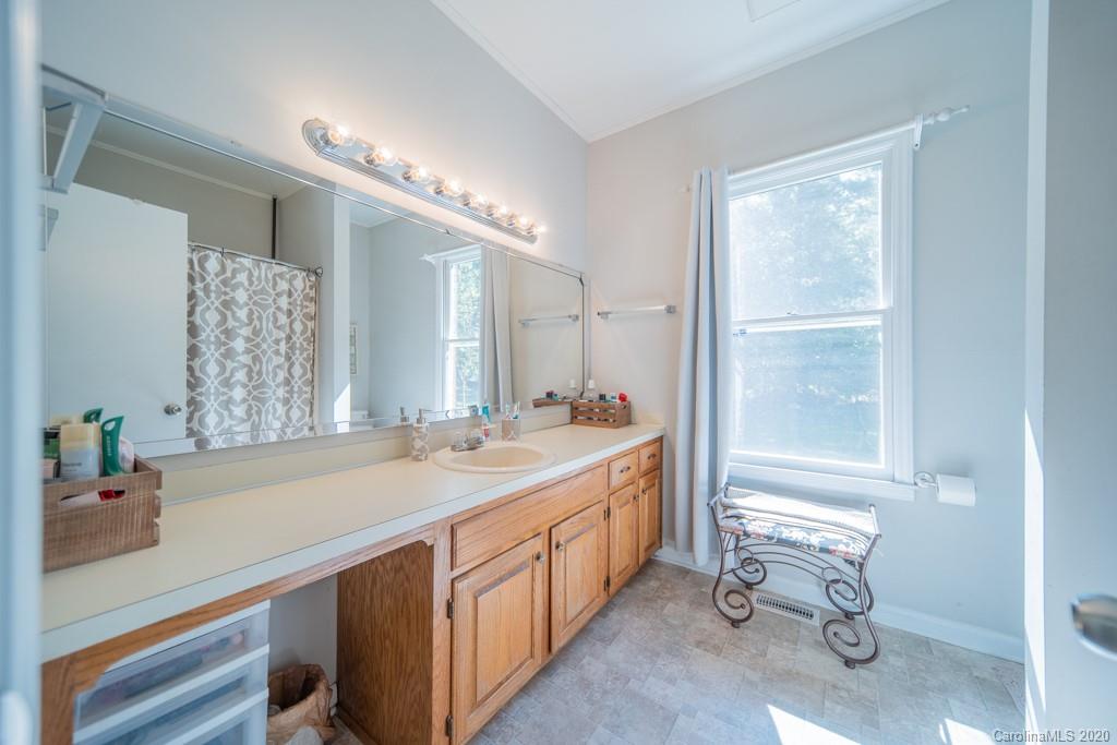 3440 Dobys Bridge Road Fort Mill, SC 29715 - Photo 24 of 25 a spacious bathroom with a double vanity sink a mirror and a bathtub