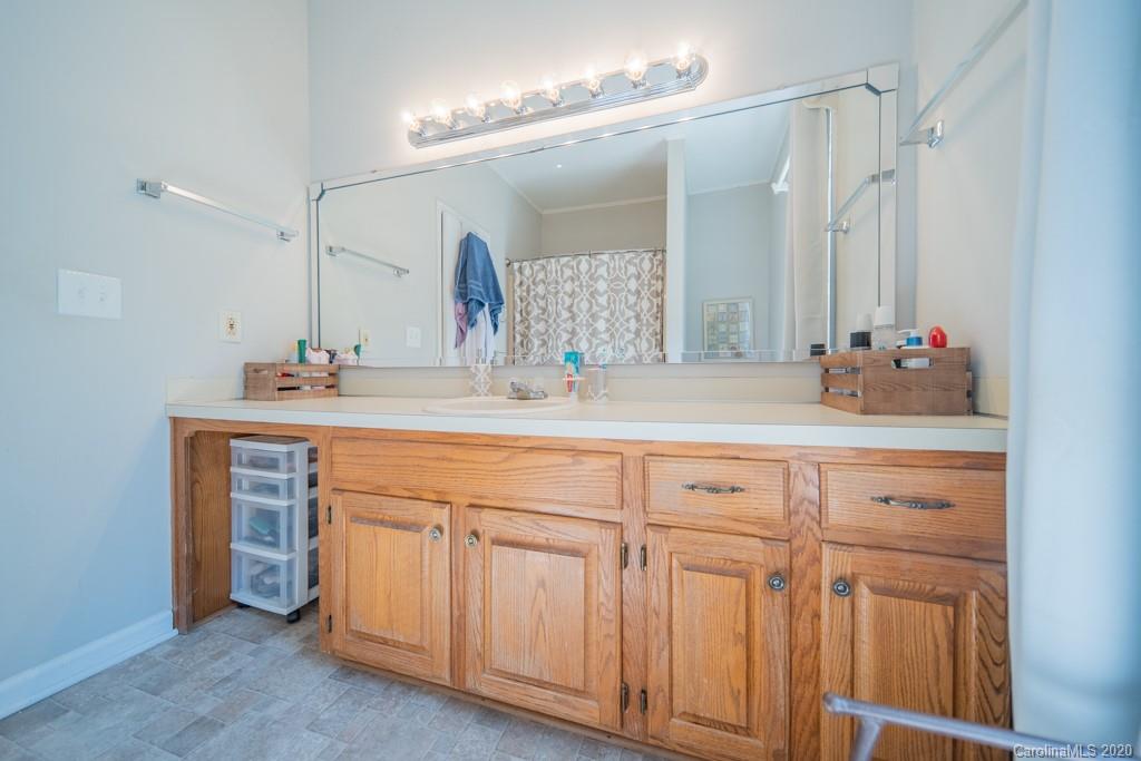 3440 Dobys Bridge Road Fort Mill, SC 29715 - Photo 25 of 25 a bathroom with a sink and a mirror