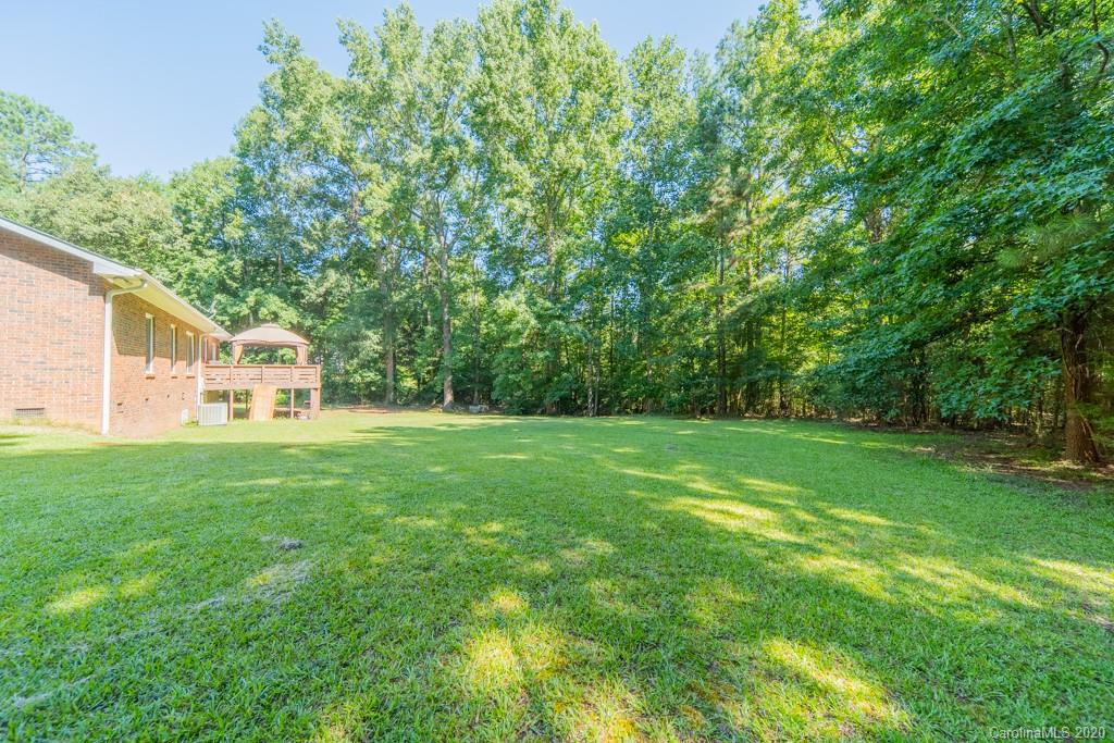 3440 Dobys Bridge Road Fort Mill, SC 29715 - Photo 5 of 25 a view of a house with a backyard