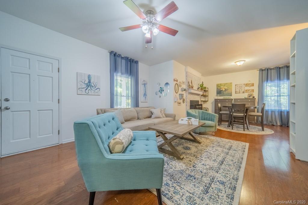 3440 Dobys Bridge Road Fort Mill, SC 29715 - Photo 6 of 25 a living room with furniture and wooden floor