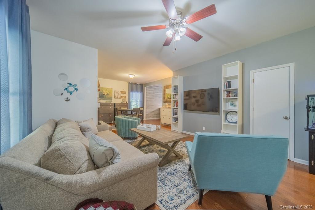 3440 Dobys Bridge Road Fort Mill, SC 29715 - Photo 7 of 25 a living room with furniture and a ceiling fan