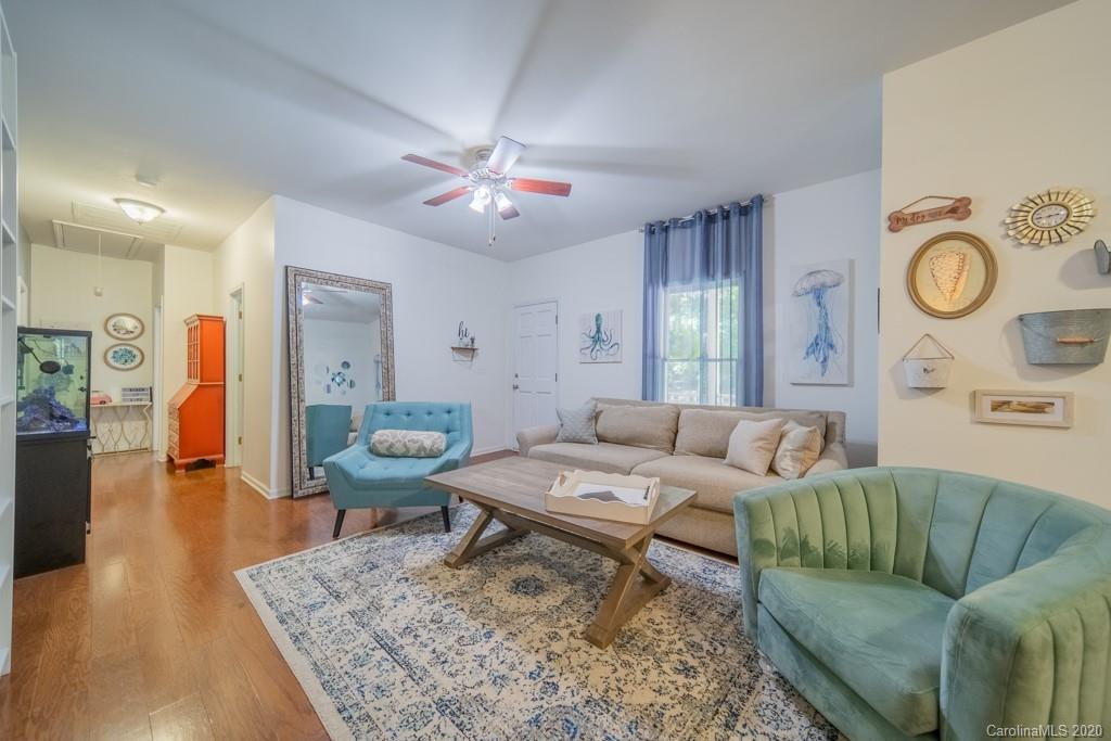 3440 Dobys Bridge Road Fort Mill, SC 29715 - Photo 8 of 25 a living room with furniture and wooden floor