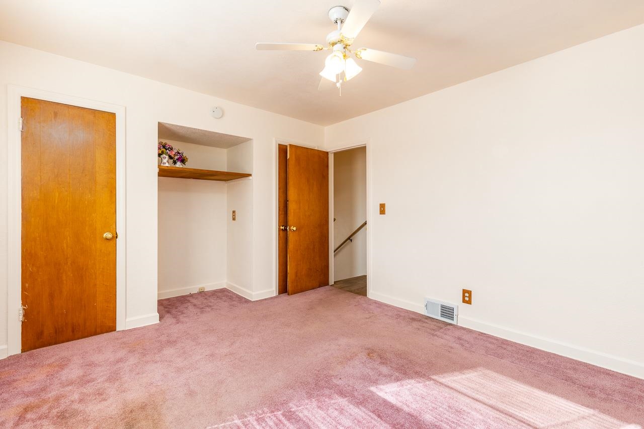 1554 Rural Street Rockford, IL 61107 - Photo 13 of 25 a view of a livingroom with a ceiling fan