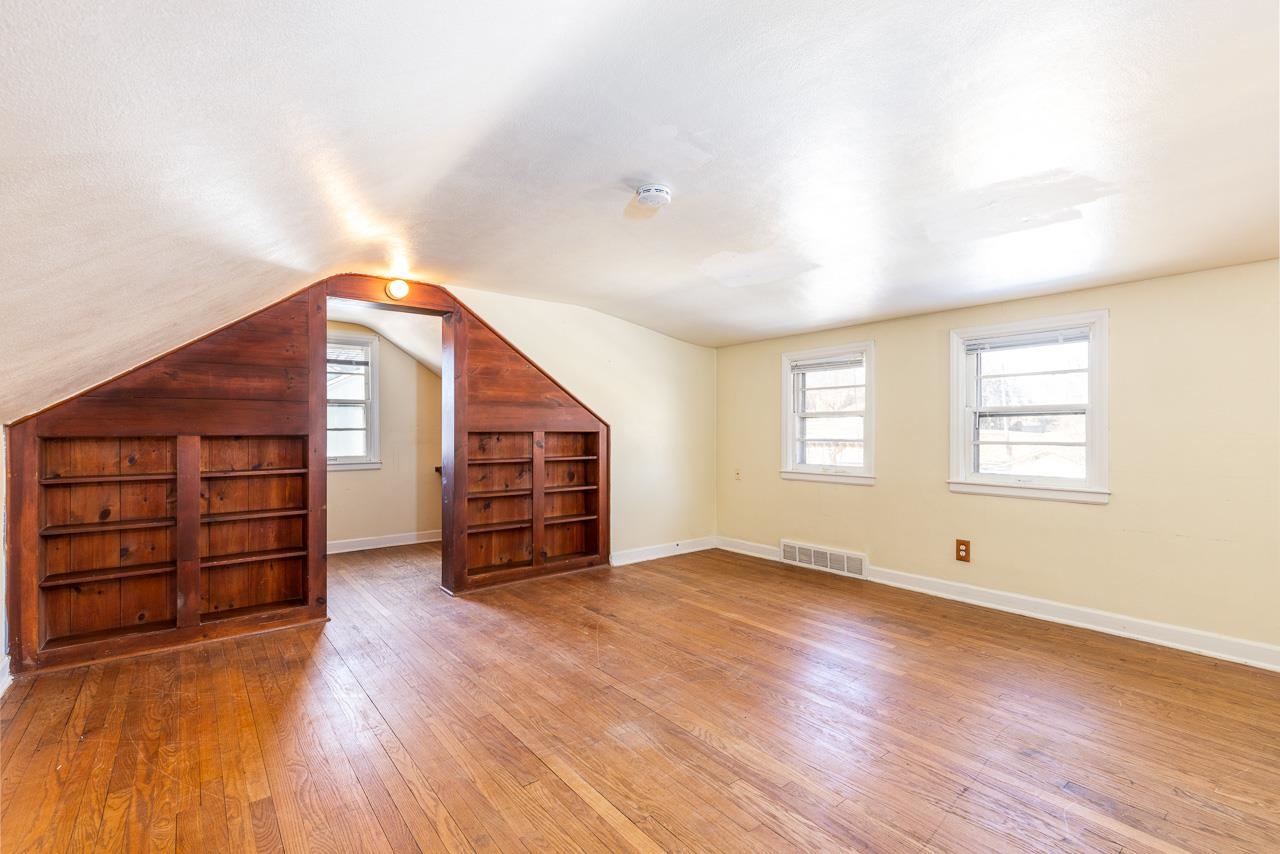 1554 Rural Street Rockford, IL 61107 - Photo 16 of 25 an empty room with wooden floor and windows