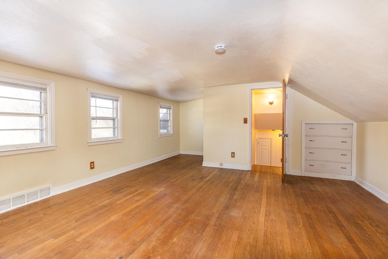 1554 Rural Street Rockford, IL 61107 - Photo 17 of 25 an empty room with wooden floor and windows