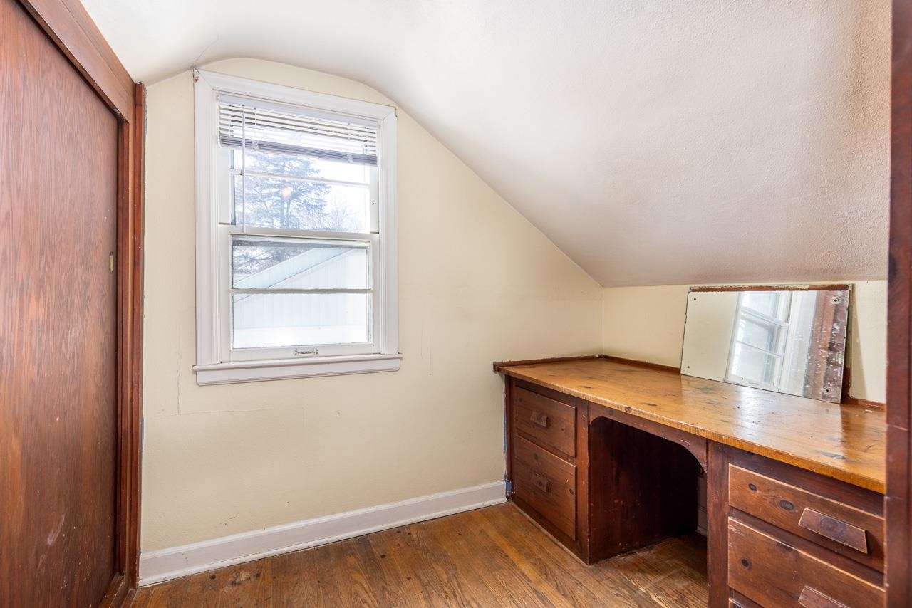 1554 Rural Street Rockford, IL 61107 - Photo 18 of 25 a room with a wooden floor and a window
