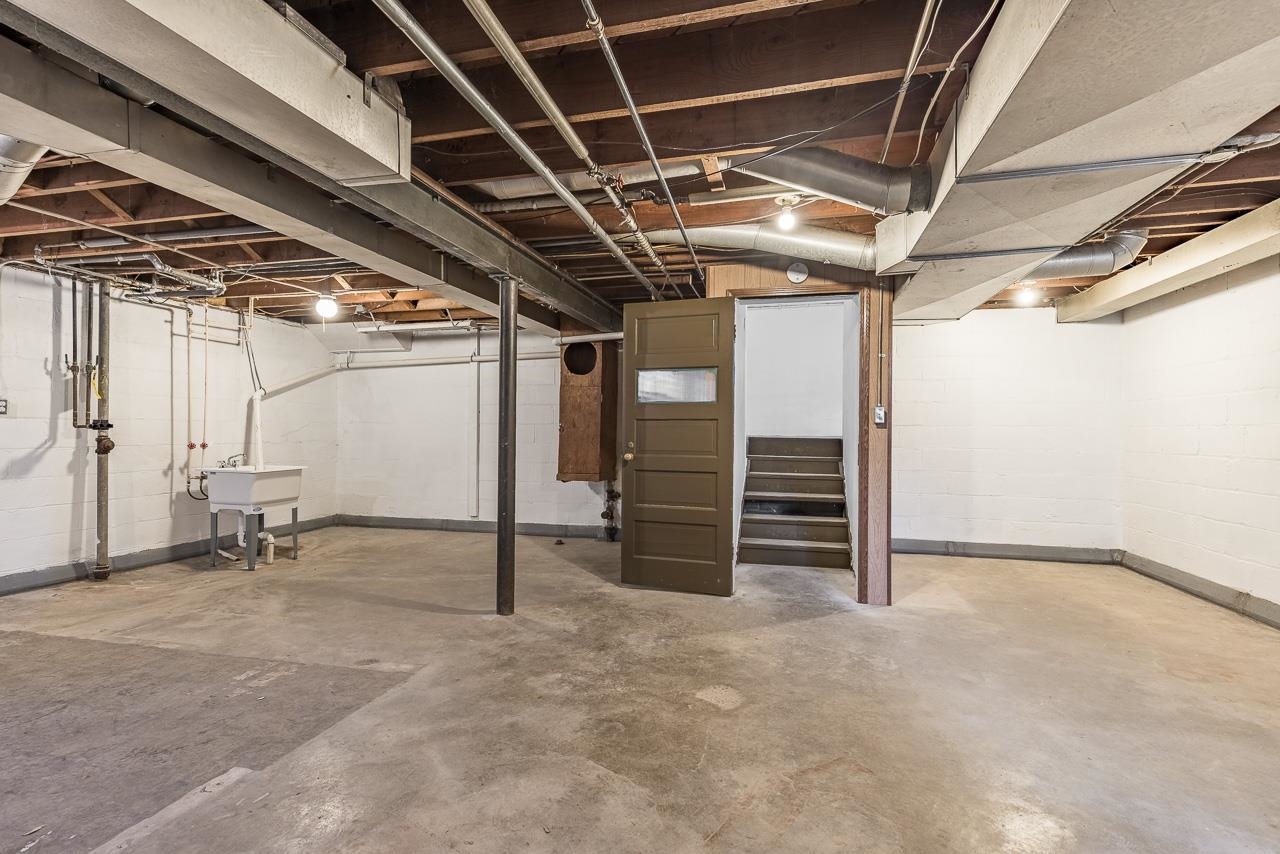 1554 Rural Street Rockford, IL 61107 - Photo 22 of 25 a view of an empty room with wooden walls