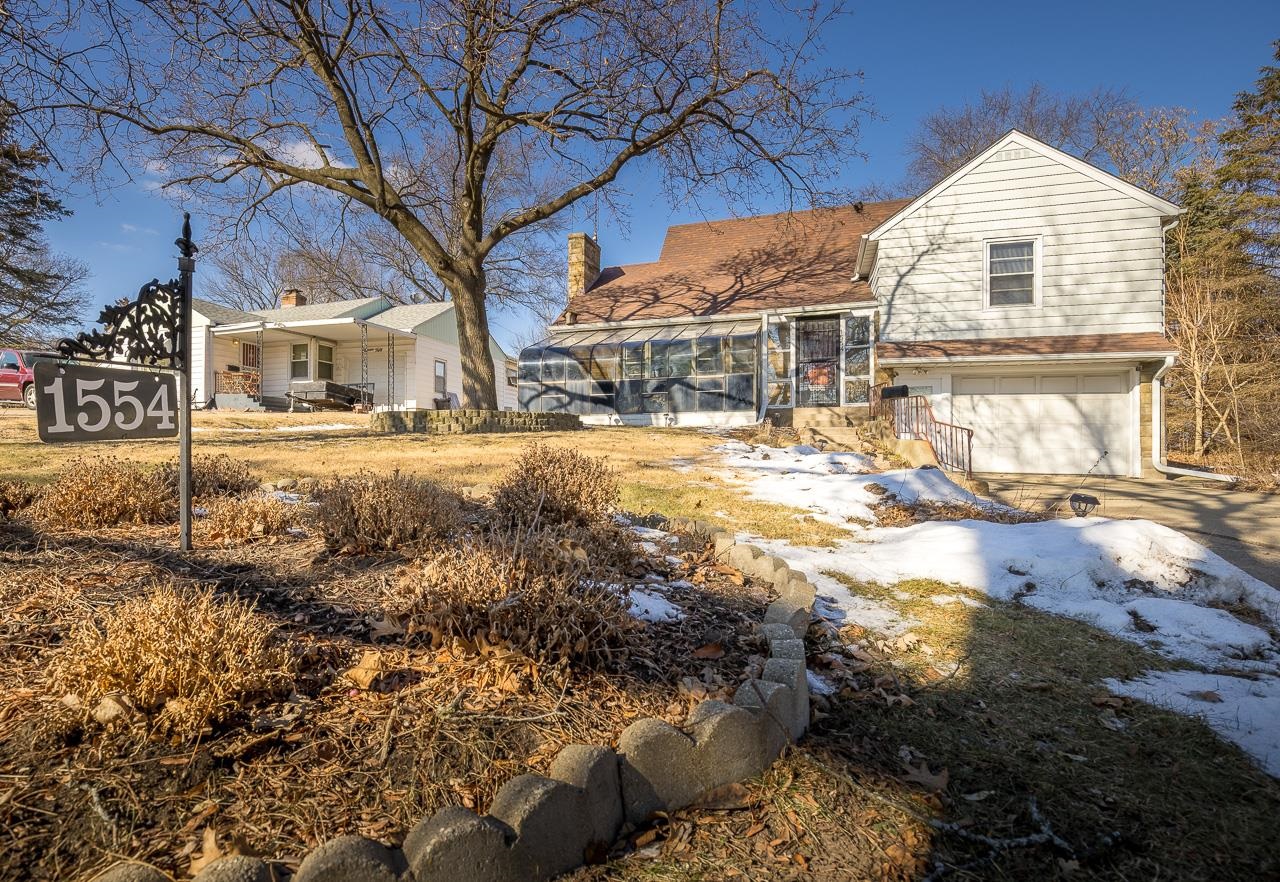 1554 Rural Street Rockford, IL 61107 - Photo 23 of 25 a view of a large white house with a yard
