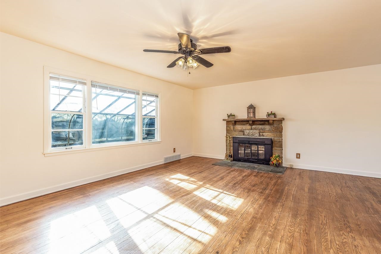 1554 Rural Street Rockford, IL 61107 - Photo 3 of 25 a view of a livingroom with a fireplace and window