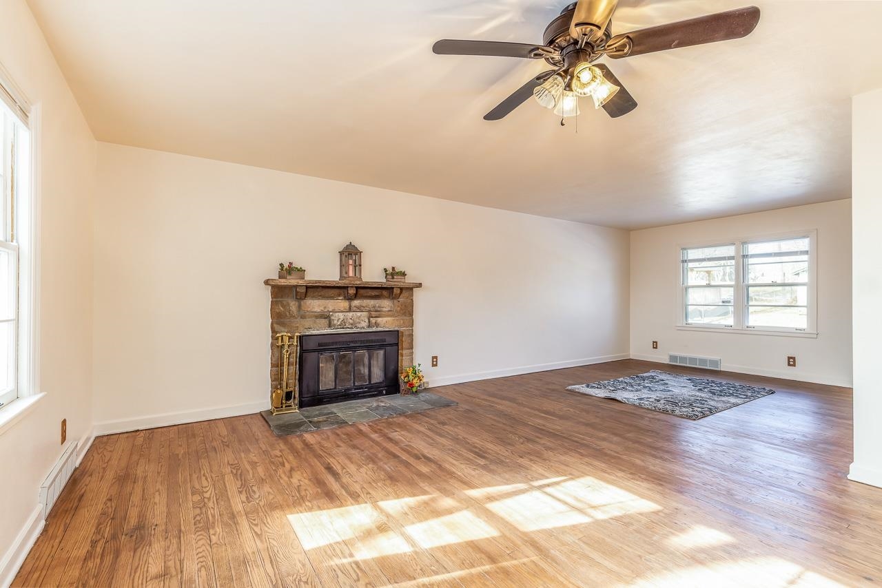 1554 Rural Street Rockford, IL 61107 - Photo 4 of 25 a bedroom with a bed and a chandelier