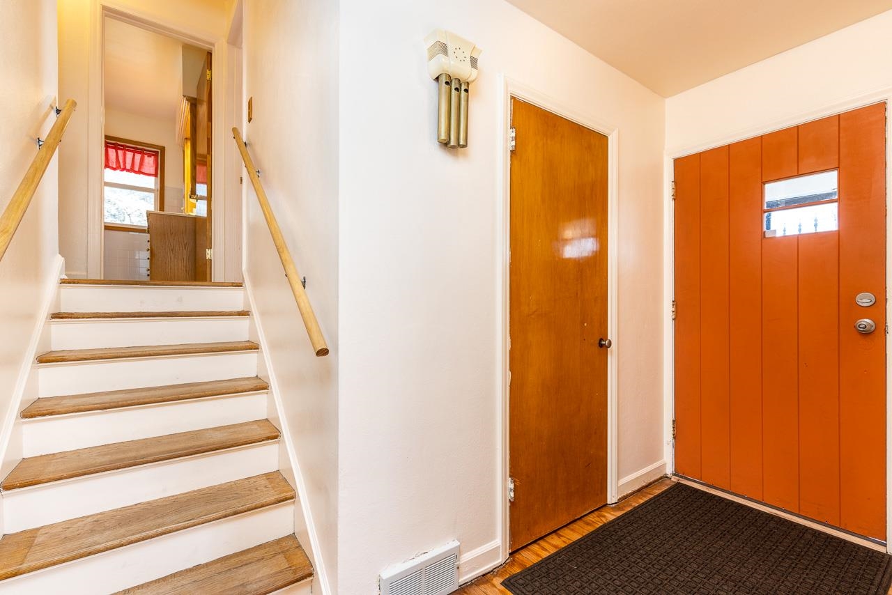 1554 Rural Street Rockford, IL 61107 - Photo 9 of 25 a view of a staircase with wooden floor and windows