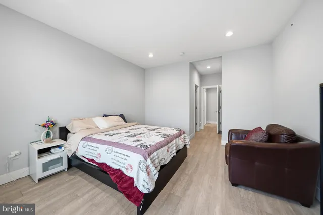 a bedroom with a bed and a couch