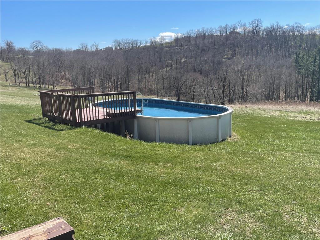 57 Pine Road Claysville, PA 15323 - Photo 13 of 16 a view of a backyard with a trampoline