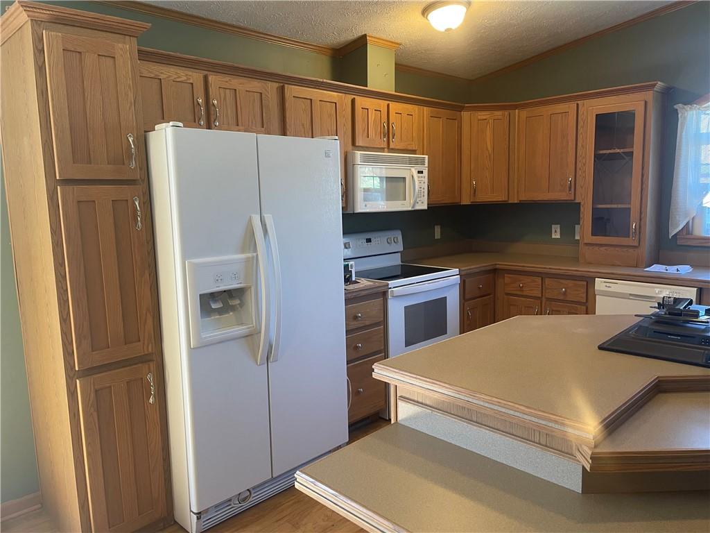 57 Pine Road Claysville, PA 15323 - Photo 3 of 16 a kitchen with stainless steel appliances a refrigerator sink and cabinets