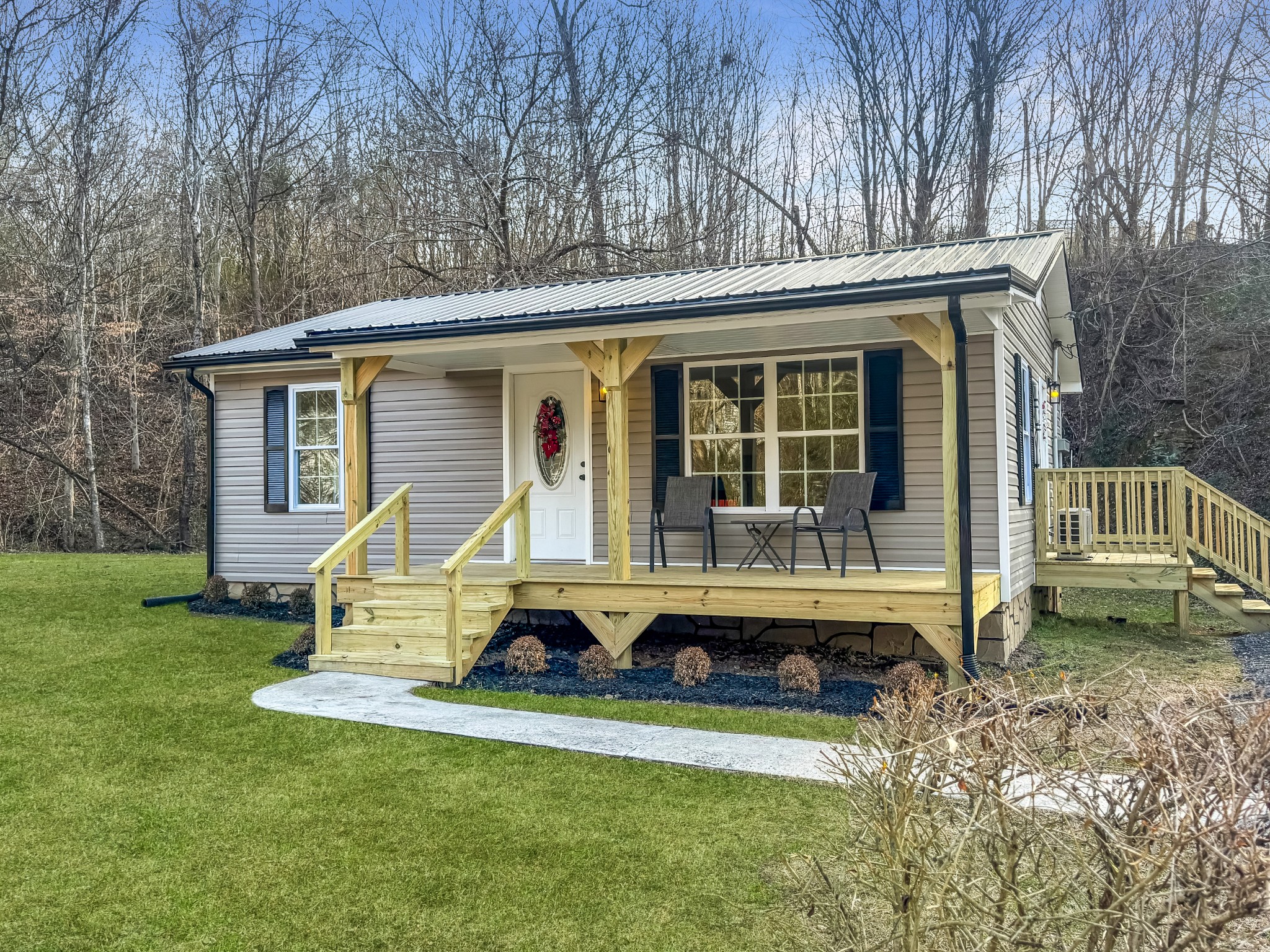 608 Big Rock Road Big Rock, TN 37023 - Photo 1 of 15 a view of a house with backyard porch and sitting area