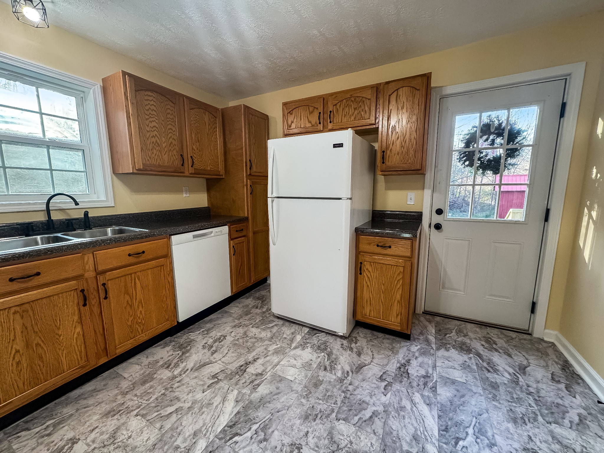 608 Big Rock Road Big Rock, TN 37023 - Photo 5 of 15 a kitchen with sink a refrigerator and cabinets